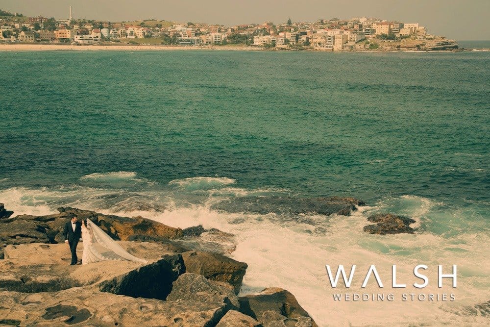Bondi beach sydney australia wedding photographers- bride and groom on rocks