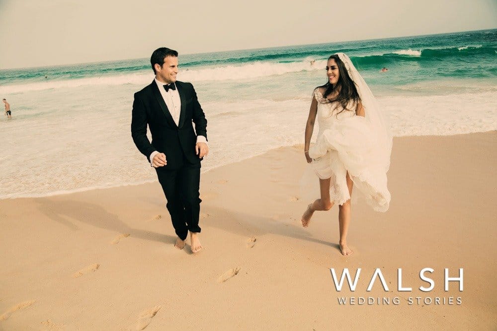 Bondi beach sydney australia wedding photographers- bride and groom running on sand