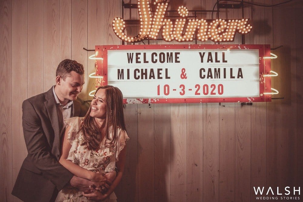 bride and groom with sign Houston wedding photographers