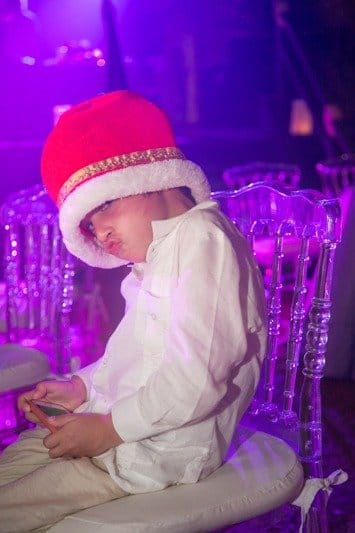 Cool kid with funky hat at Cancun wedding- Xcaret wedding